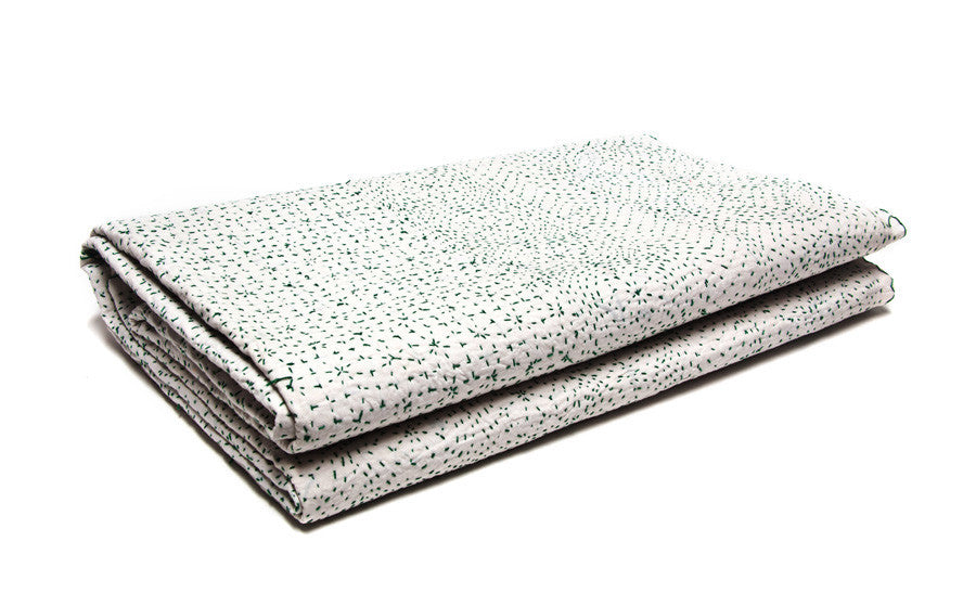 Green stitching on Snow